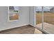 Bedroom featuring wood floors, and sliding glass doors leading to a backyard at 1106 Cherrystone Loop, Conway, SC 29526