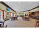 Spacious dining area with multiple tables and chairs, complemented by a bar area and ample natural light at 1106 Cherrystone Loop, Conway, SC 29526