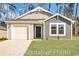 Charming single-story home with a one-car garage, well-maintained lawn, and inviting front entrance at 1106 Cherrystone Loop, Conway, SC 29526