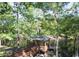 Picturesque gazebo overlooking a tranquil lake, surrounded by lush greenery and mature trees at 1106 Cherrystone Loop, Conway, SC 29526
