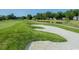 Lush green golf course featuring a sand trap, pond, and well-manicured landscaping at 1106 Cherrystone Loop, Conway, SC 29526