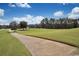 Scenic golf course with a paved path, verdant fairways, and mature trees under a clear sky at 1106 Cherrystone Loop, Conway, SC 29526