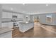 Open-concept kitchen featuring an island, granite countertops, stainless steel appliances, and hardwood floors at 1106 Cherrystone Loop, Conway, SC 29526