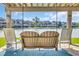 Inviting back porch with lake views and a swing, perfect for outdoor seating and relaxation with beautiful weather at 112 Spartina Ct. # 26, Pawleys Island, SC 29585