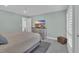Relaxing bedroom featuring a dresser with a mounted television and natural light from a window at 112 Spartina Ct. # 26, Pawleys Island, SC 29585