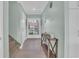 Inviting hallway with console table and stairwell leading to carpeted stairs at 112 Spartina Ct. # 26, Pawleys Island, SC 29585