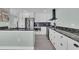 Bright kitchen featuring stainless steel appliances, granite countertops, and white cabinets at 112 Spartina Ct. # 26, Pawleys Island, SC 29585