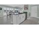 Modern kitchen island with bar seating, stainless steel dishwasher, and scenic views from the windows at 112 Spartina Ct. # 26, Pawleys Island, SC 29585