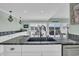 Modern kitchen features marble counters, white cabinets, and stainless steel appliances, creating a luxurious cooking space at 112 Spartina Ct. # 26, Pawleys Island, SC 29585