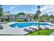 Community pool area with lounge chairs and shade, nestled within lush landscaping and residential buildings at 112 Spartina Ct. # 26, Pawleys Island, SC 29585
