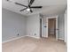 Bedroom featuring neutral carpet, a ceiling fan, and two doors at 113 Winding Path Dr., Loris, SC 29569