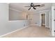Bonus room with neutral carpet, ceiling fan and two doors leading to other rooms at 113 Winding Path Dr., Loris, SC 29569
