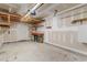 Spacious garage with exposed ceiling and storage shelves at 113 Winding Path Dr., Loris, SC 29569
