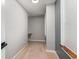 Hallway with neutral carpet and gray walls that leads to a walk in closet at 113 Winding Path Dr., Loris, SC 29569