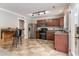 Modern kitchen features stainless steel appliances and a rustic wooden bar with seating at 113 Winding Path Dr., Loris, SC 29569