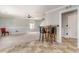 Spacious open-concept living room and kitchen with breakfast bar seating and modern ceiling fan at 113 Winding Path Dr., Loris, SC 29569