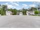 Street view features multiple residences each with garages and trees surrounding them at 113 Winding Path Dr., Loris, SC 29569