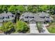 Aerial view of townhomes showing roof, driveways, and mature landscaping in a residential neighborhood at 115 Harbor Club Dr. # 4A, Pawleys Island, SC 29585