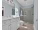 Well-lit bathroom with double sink vanity, glass shower, and modern fixtures at 115 Harbor Club Dr. # 4A, Pawleys Island, SC 29585