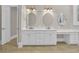 Bright bathroom features double sinks with a vanity area and a separate door at 115 Harbor Club Dr. # 4A, Pawleys Island, SC 29585