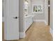 Well-lit bathroom featuring double sinks, white cabinetry, and a large window at 115 Harbor Club Dr. # 4A, Pawleys Island, SC 29585