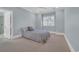 Comfortable bedroom with neutral tones and a window with plantation shutters at 115 Harbor Club Dr. # 4A, Pawleys Island, SC 29585