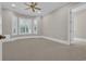 Bedroom with neutral colored carpet and plenty of natural light at 115 Harbor Club Dr. # 4A, Pawleys Island, SC 29585