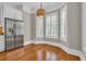 Breakfast nook with stainless steel refrigerator and light from windows with wooden shutters at 115 Harbor Club Dr. # 4A, Pawleys Island, SC 29585