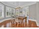 Dining room with hardwood floors and lots of light from windows with wooden shutters at 115 Harbor Club Dr. # 4A, Pawleys Island, SC 29585