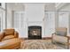 Elegant fireplace with built-in shelving on each side of the fireplace and a comfortable seating area at 115 Harbor Club Dr. # 4A, Pawleys Island, SC 29585