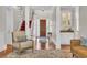 Warm entry foyer features hardwood floors, a staircase, and access to a dry bar at 115 Harbor Club Dr. # 4A, Pawleys Island, SC 29585