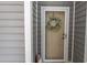 Charming front door with a wreath and decorative accents on the exterior at 118 Ella Kinley Circle # 404, Myrtle Beach, SC 29588