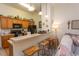 Well-equipped kitchen with wood cabinets, appliances, and bar seating overlooking the living area at 118 Ella Kinley Circle # 404, Myrtle Beach, SC 29588
