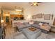 Living room showcases a large gray couch, matching ottoman, and neutral decor at 118 Ella Kinley Circle # 404, Myrtle Beach, SC 29588