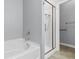 Bathroom featuring a tiled shower and separate soaking tub at 120 Carolina Crossing Blvd., Little River, SC 29566