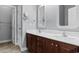 Bathroom featuring double sinks with a wooden vanity and framed mirrors at 120 Carolina Crossing Blvd., Little River, SC 29566