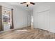 Bright bedroom featuring a window, closet, ceiling fan and hardwood floors at 120 Carolina Crossing Blvd., Little River, SC 29566