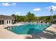 Community pool with several lounge chairs and a nearby pool house at 120 Carolina Crossing Blvd., Little River, SC 29566