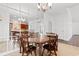 Dining room with wood table, mirrored wall, and views into the kitchen and another living space at 120 Carolina Crossing Blvd., Little River, SC 29566