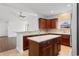 Stylish kitchen featuring a center island, ample counter space, and wooden cabinetry, perfect for cooking and entertaining at 120 Carolina Crossing Blvd., Little River, SC 29566