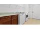 Laundry room with cabinetry, wire rack shelving, and washer and dryer at 120 Carolina Crossing Blvd., Little River, SC 29566