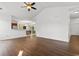 Open living room space with hardwood floors leading into the kitchen and dining area at 120 Carolina Crossing Blvd., Little River, SC 29566