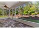 A beautiful screened-in porch with lovely views and a ceiling fan at 120 Carolina Crossing Blvd., Little River, SC 29566