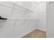 Walk-in closet featuring multiple shelves and carpeted flooring at 120 Carolina Crossing Blvd., Little River, SC 29566