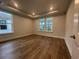 Comfortable bedroom featuring recessed lighting, beautiful hardwood floors, and lots of natural light at 1209 Lady Bird Way, North Myrtle Beach, SC 29582