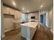 Well-lit kitchen boasting a spacious island, stainless steel appliances and ample counter space at 1209 Lady Bird Way, North Myrtle Beach, SC 29582
