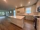 Open-concept kitchen featuring an island, stainless steel appliances, and hardwood floors at 1209 Lady Bird Way, North Myrtle Beach, SC 29582