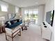 A bright living room with modern furniture, a view of the patio, and plenty of space to relax at 1209 Lady Bird Way, North Myrtle Beach, SC 29582