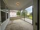 Screened-in porch offering an outdoor living space with views of the backyard, perfect for relaxation and entertaining at 1209 Lady Bird Way, North Myrtle Beach, SC 29582