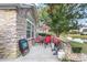 Backyard patio area with seating, a grill, and a peaceful pond view at 145 Stonegate Blvd. # 145, Murrells Inlet, SC 29576